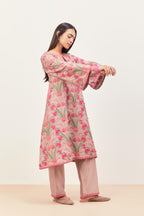 Lilac short A-line silk chanderi kurta set, fully embroidered with appliqué flowers, highlighted with aari thread work and silk tassels.