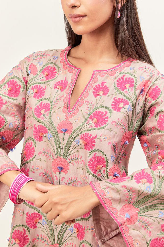 Lilac short A-line silk chanderi kurta set, fully embroidered with appliqué flowers, highlighted with aari thread work and silk tassels.