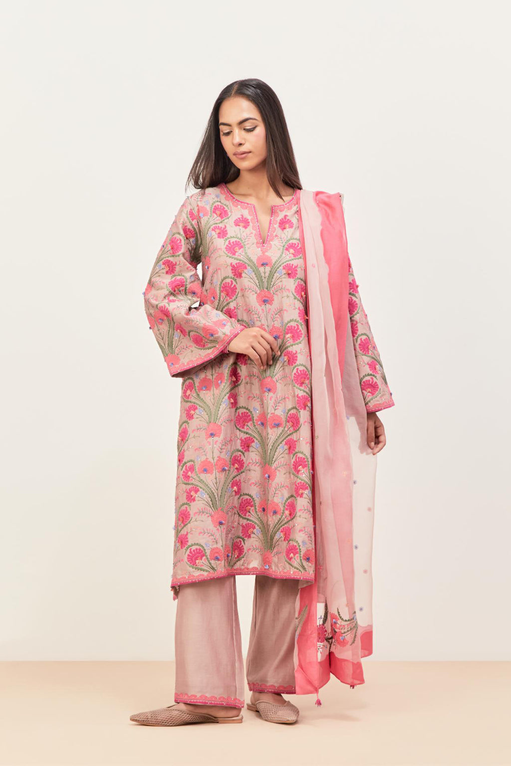Lilac short A-line silk chanderi kurta set, fully embroidered with appliqué flowers, highlighted with aari thread work and silk tassels.