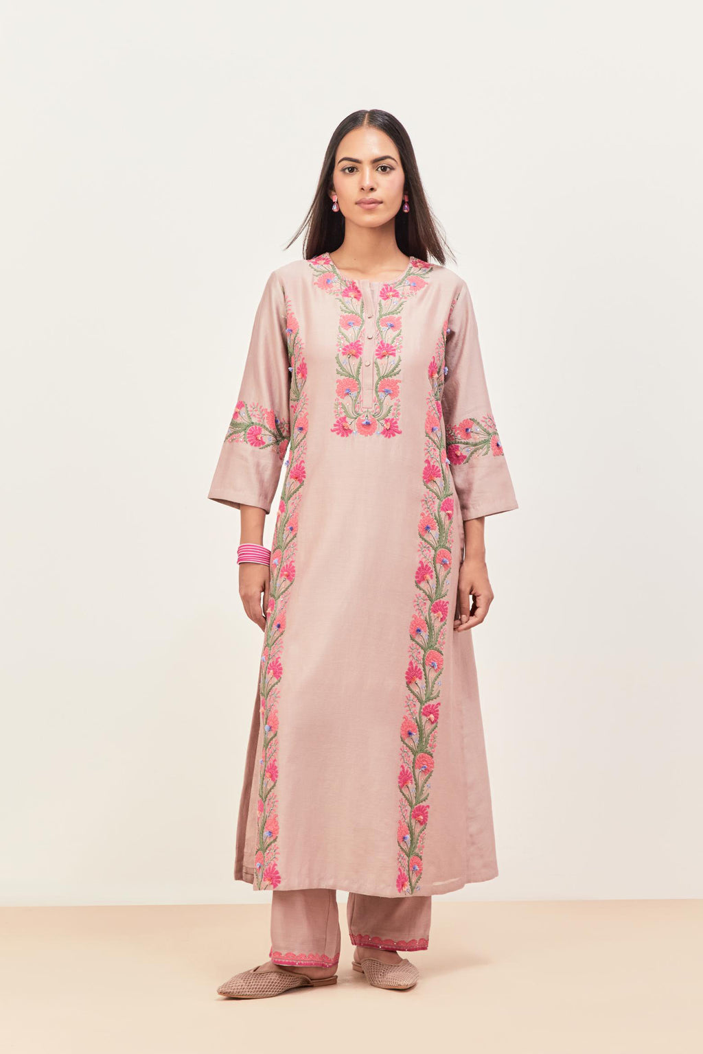 Lilac silk chanderi straight kurta set, decorated with appliqué borders along the side panels, neck and sleeves.