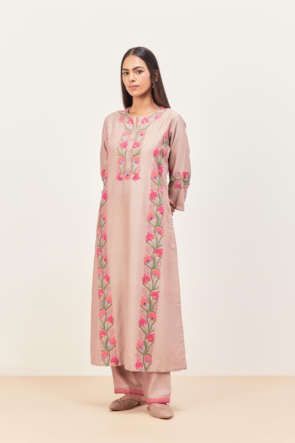 Lilac silk chanderi straight kurta set, decorated with appliqué borders along the side panels, neck and sleeves.
