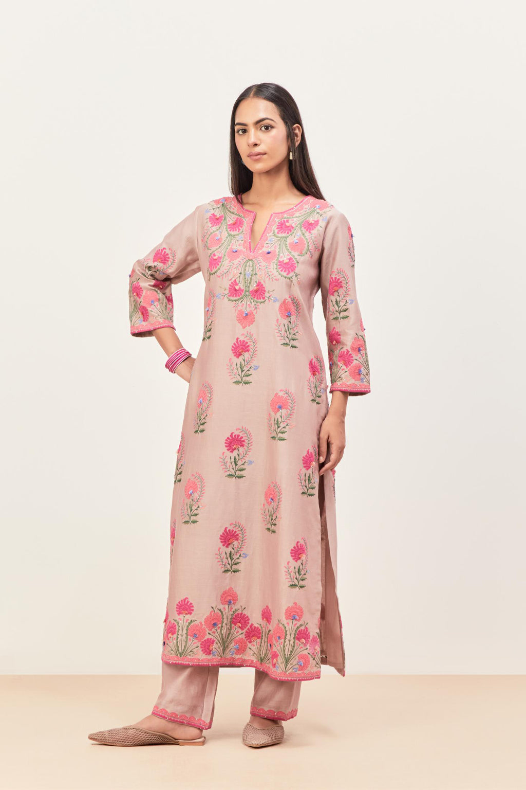 Lilac silk chanderi straight kurta set, decorated with appliqued jaal neckline and hem. The field has symmetrically placed bootas.