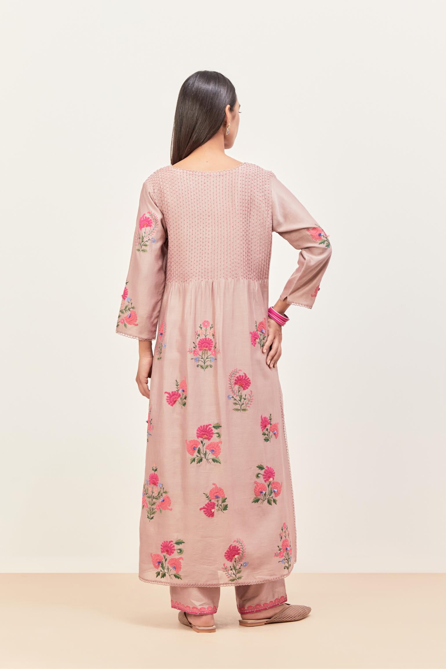 Lilac silk chanderi kurta set with pin tucks at yoke and all-over applique, highlighted with aari threadwork & sequins.