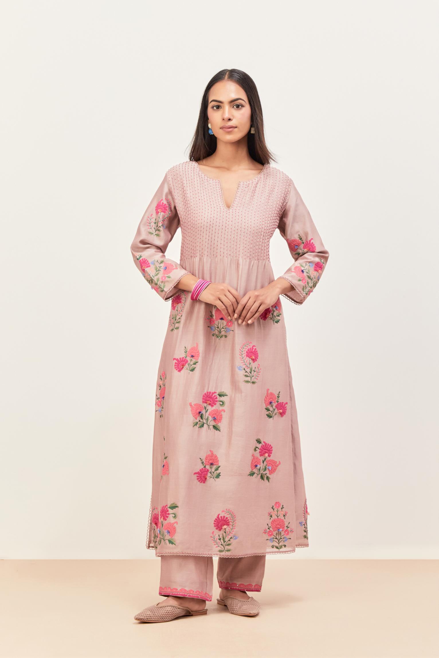 Lilac silk chanderi kurta set with pin tucks at yoke and all-over applique, highlighted with aari threadwork & sequins.