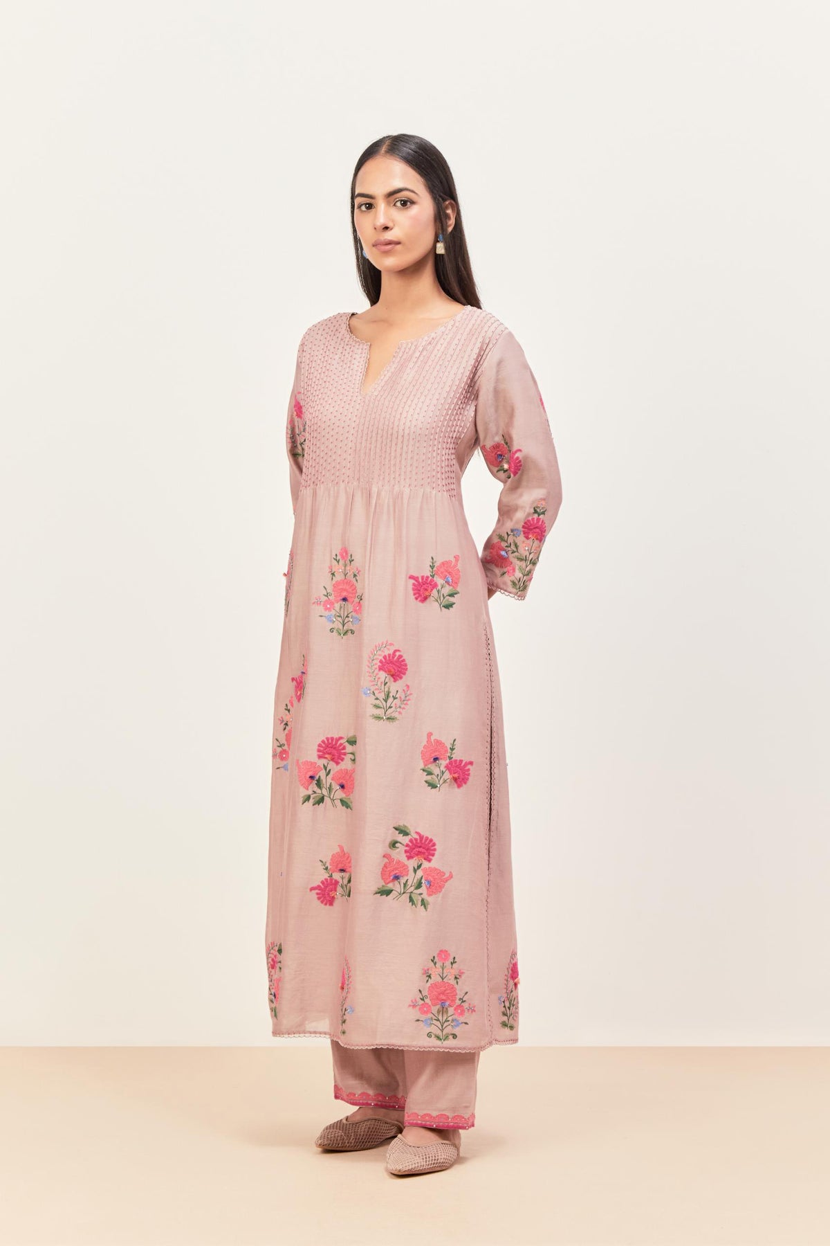 Lilac silk chanderi kurta set with pin tucks at yoke and all-over applique, highlighted with aari threadwork & sequins.