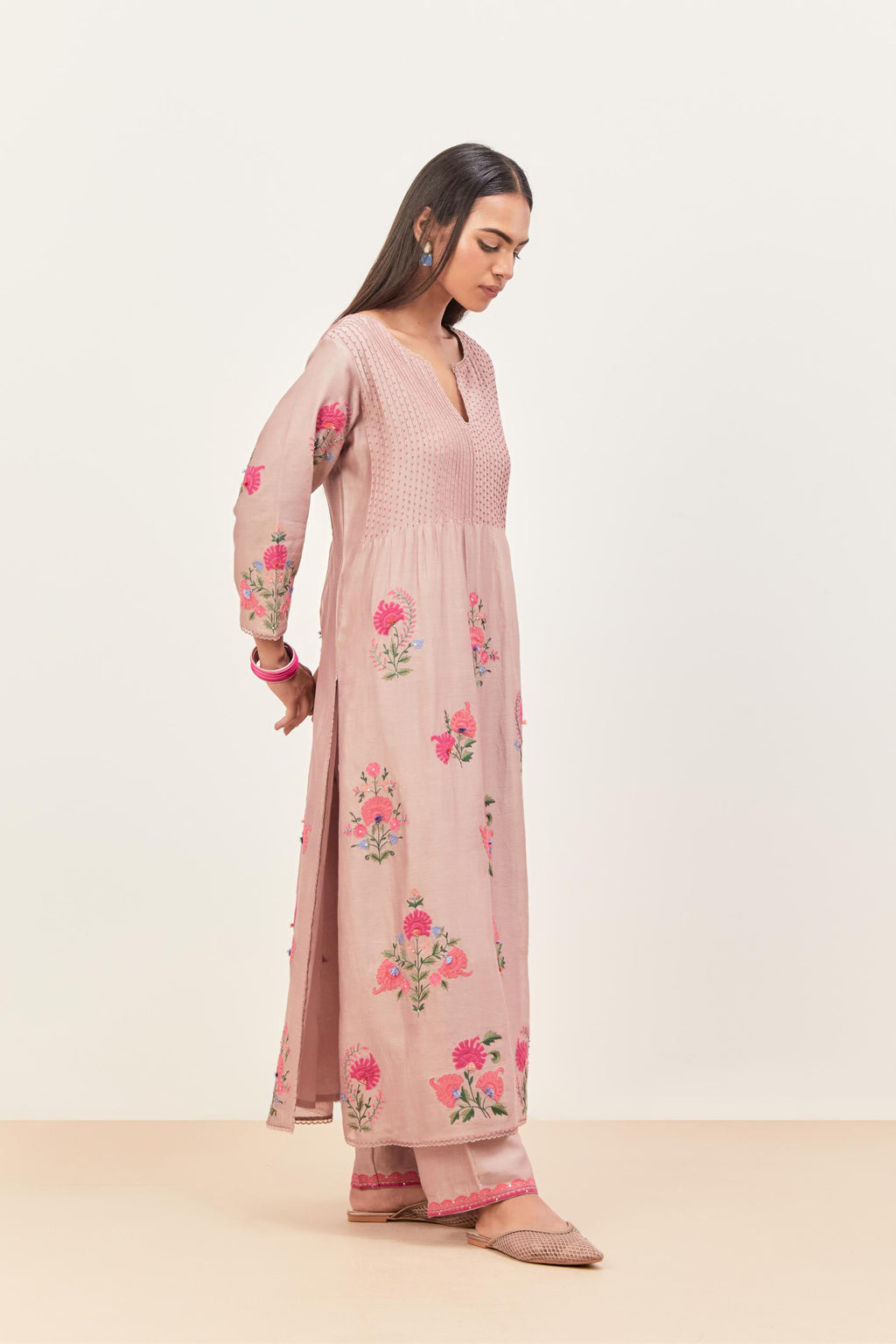 Lilac silk chanderi kurta set with pin tucks at yoke and all-over applique, highlighted with aari threadwork & sequins.