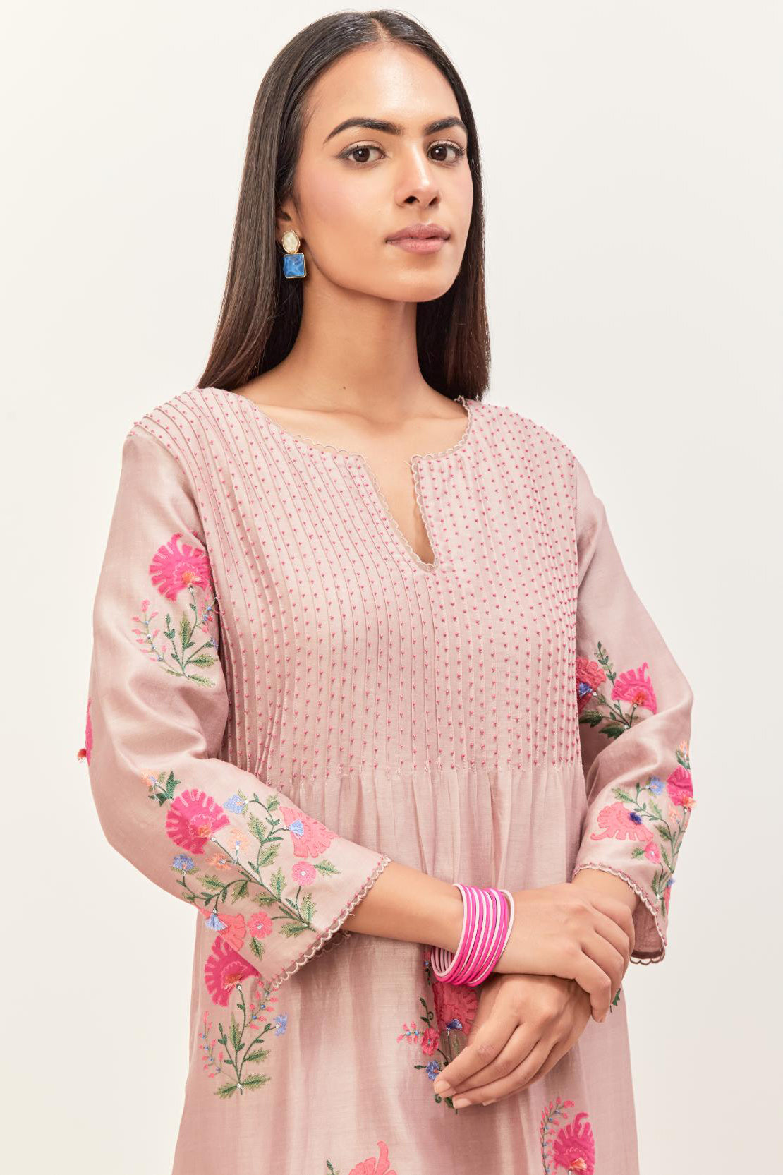 Lilac silk chanderi kurta set with pin tucks at yoke and all-over applique, highlighted with aari threadwork & sequins.