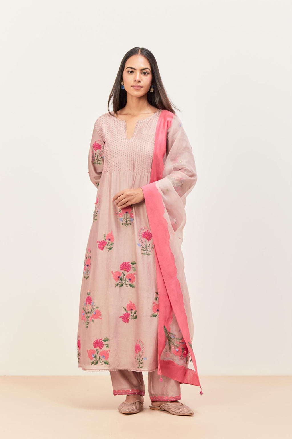 Lilac silk chanderi kurta set with pin tucks at yoke and all-over applique, highlighted with aari threadwork & sequins.
