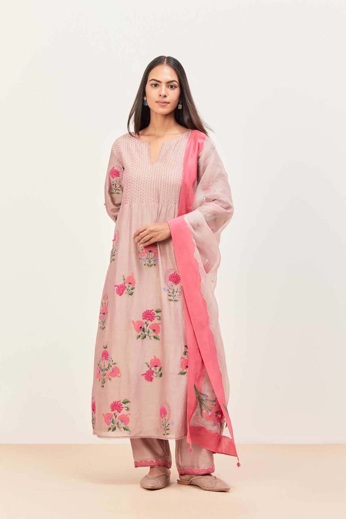 Lilac silk chanderi kurta set with pin tucks at yoke and all-over applique, highlighted with aari threadwork & sequins.