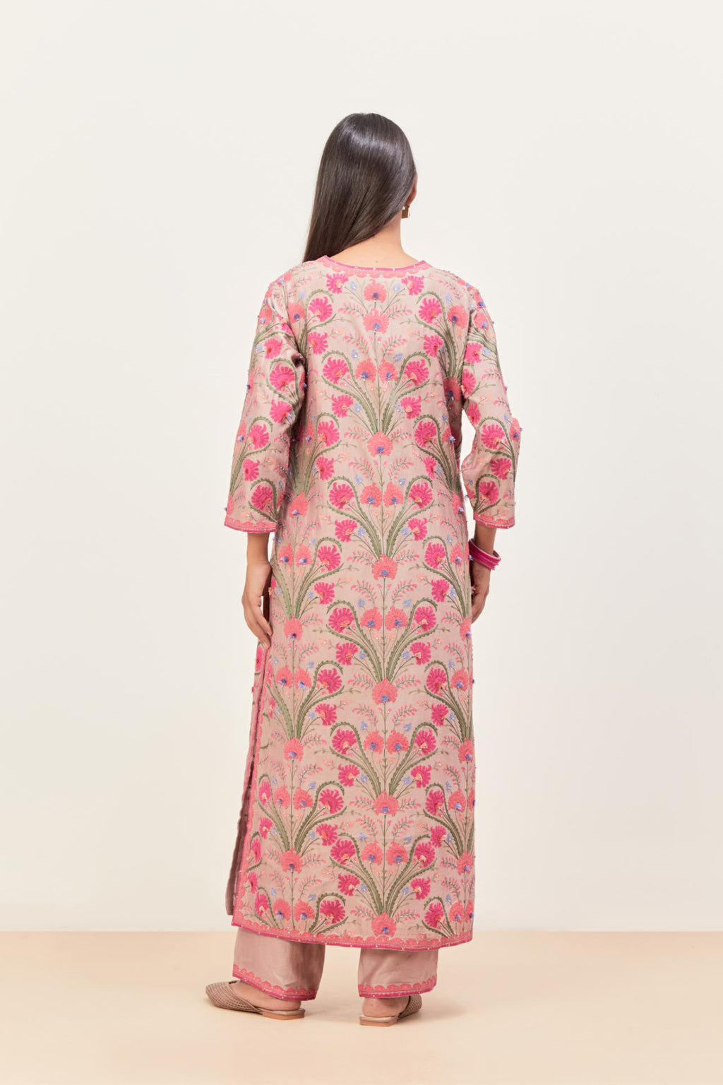 Lilac straight kurta set, fully embroidered with appliqué flowers, multi-colored aari threadwork and silk tassels.
