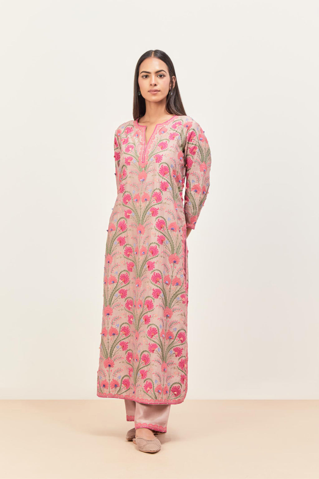 Lilac straight kurta set, fully embroidered with appliqué flowers, multi-colored aari threadwork and silk tassels.