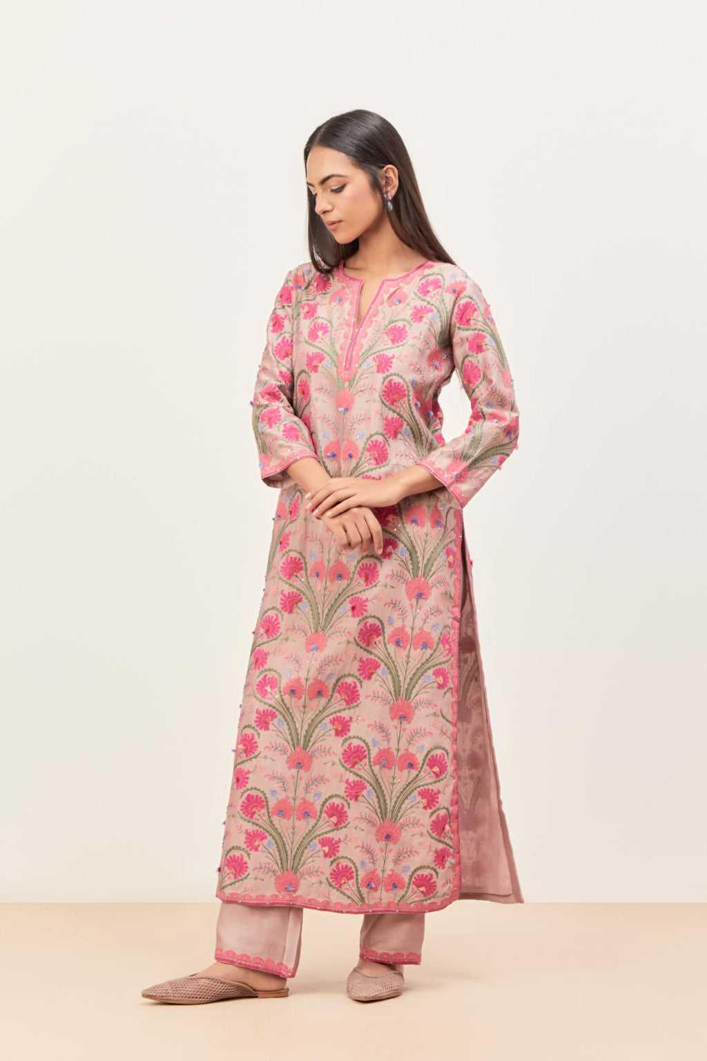 Lilac straight kurta set, fully embroidered with appliqué flowers, multi-colored aari threadwork and silk tassels.