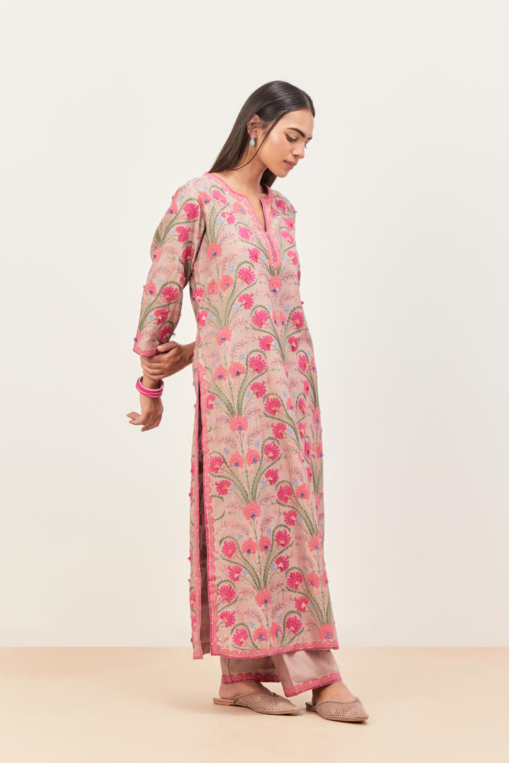 Lilac straight kurta set, fully embroidered with appliqué flowers, multi-colored aari threadwork and silk tassels.