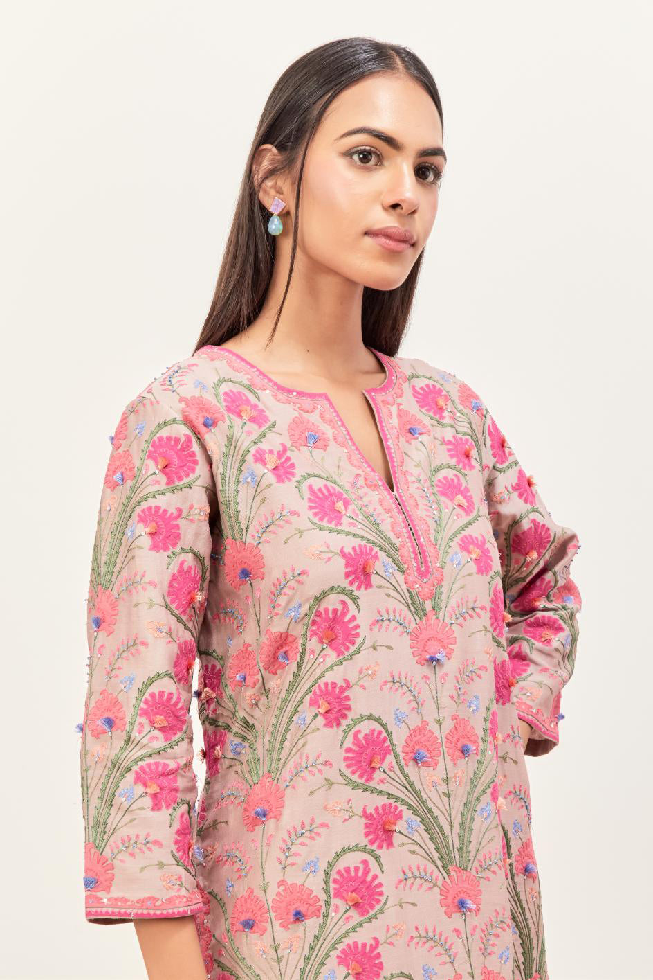 Lilac straight kurta set, fully embroidered with appliqué flowers, multi-colored aari threadwork and silk tassels.