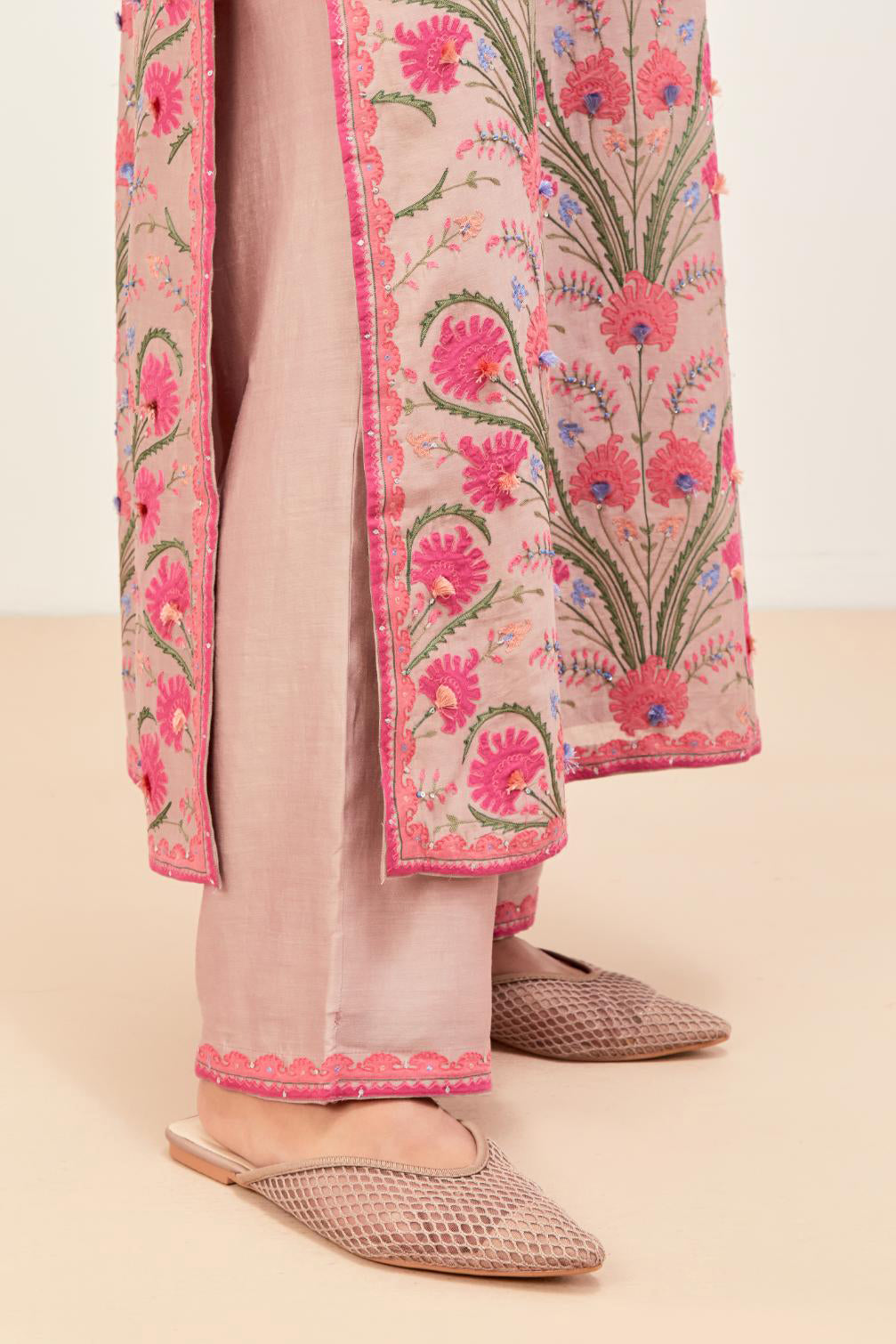 Lilac straight kurta set, fully embroidered with appliqué flowers, multi-colored aari threadwork and silk tassels.