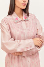 Lilac silk chanderi shirt with all-over pin tucks, highlighted with contrast beads in the front, paired with Lilac silk chanderi straight pants detailed with multi colored applique, highlighted with sequins work at bottom hem.