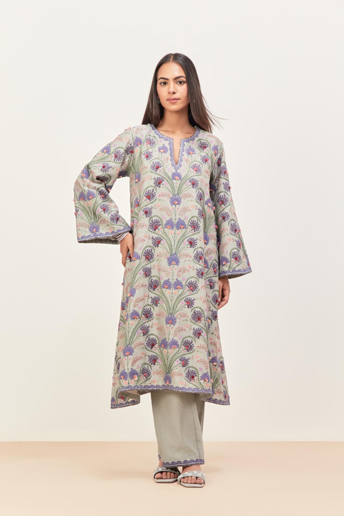 Bluish Grey short A-line silk chanderi kurta set, fully embroidered with appliqué flowers, highlighted with aari thread work and silk tassels.