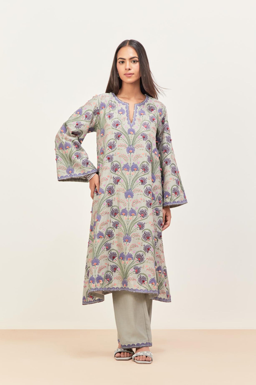 Bluish Grey short A-line silk chanderi kurta set, fully embroidered with appliqué flowers, highlighted with aari thread work and silk tassels.