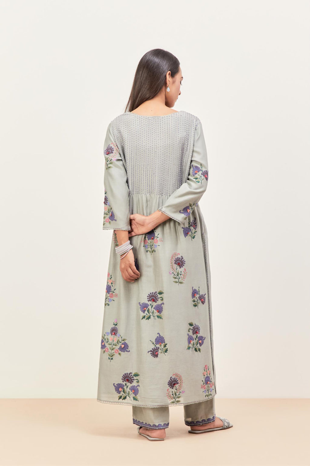Bluish Grey silk chanderi kurta set with pin tucks at yoke and all-over applique, highlighted with aari threadwork & sequins.