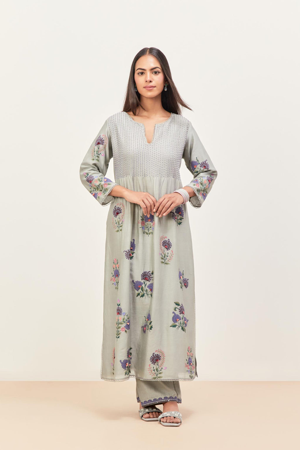 Bluish Grey silk chanderi kurta set with pin tucks at yoke and all-over applique, highlighted with aari threadwork & sequins.