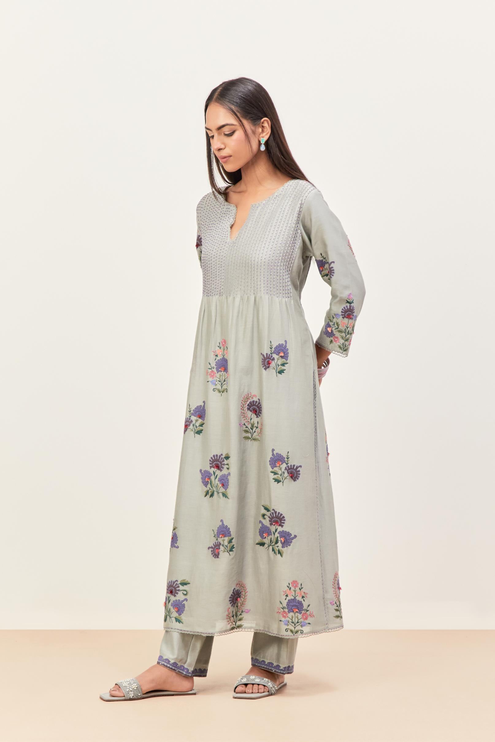 Bluish Grey silk chanderi kurta set with pin tucks at yoke and all-over applique, highlighted with aari threadwork & sequins.