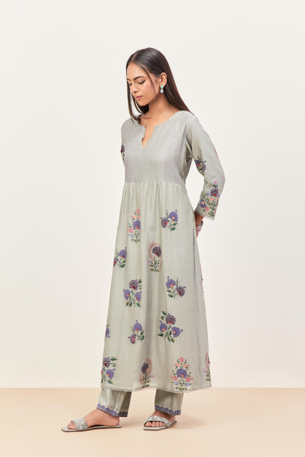 Bluish Grey silk chanderi kurta set with pin tucks at yoke and all-over applique, highlighted with aari threadwork & sequins.