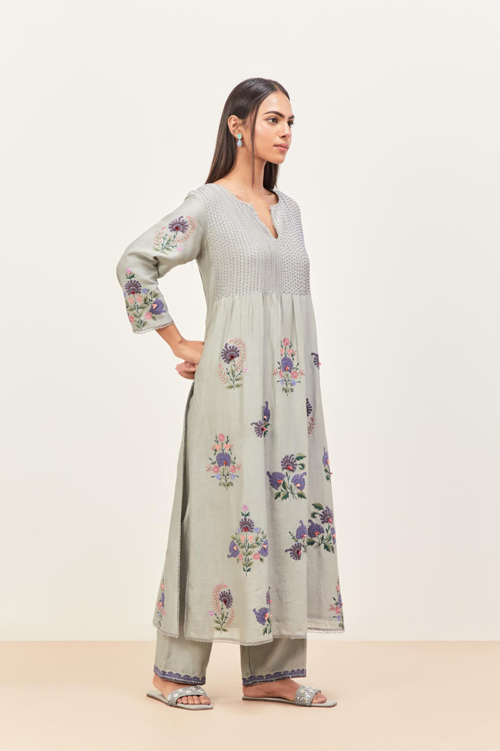 Bluish Grey silk chanderi kurta set with pin tucks at yoke and all-over applique, highlighted with aari threadwork & sequins.