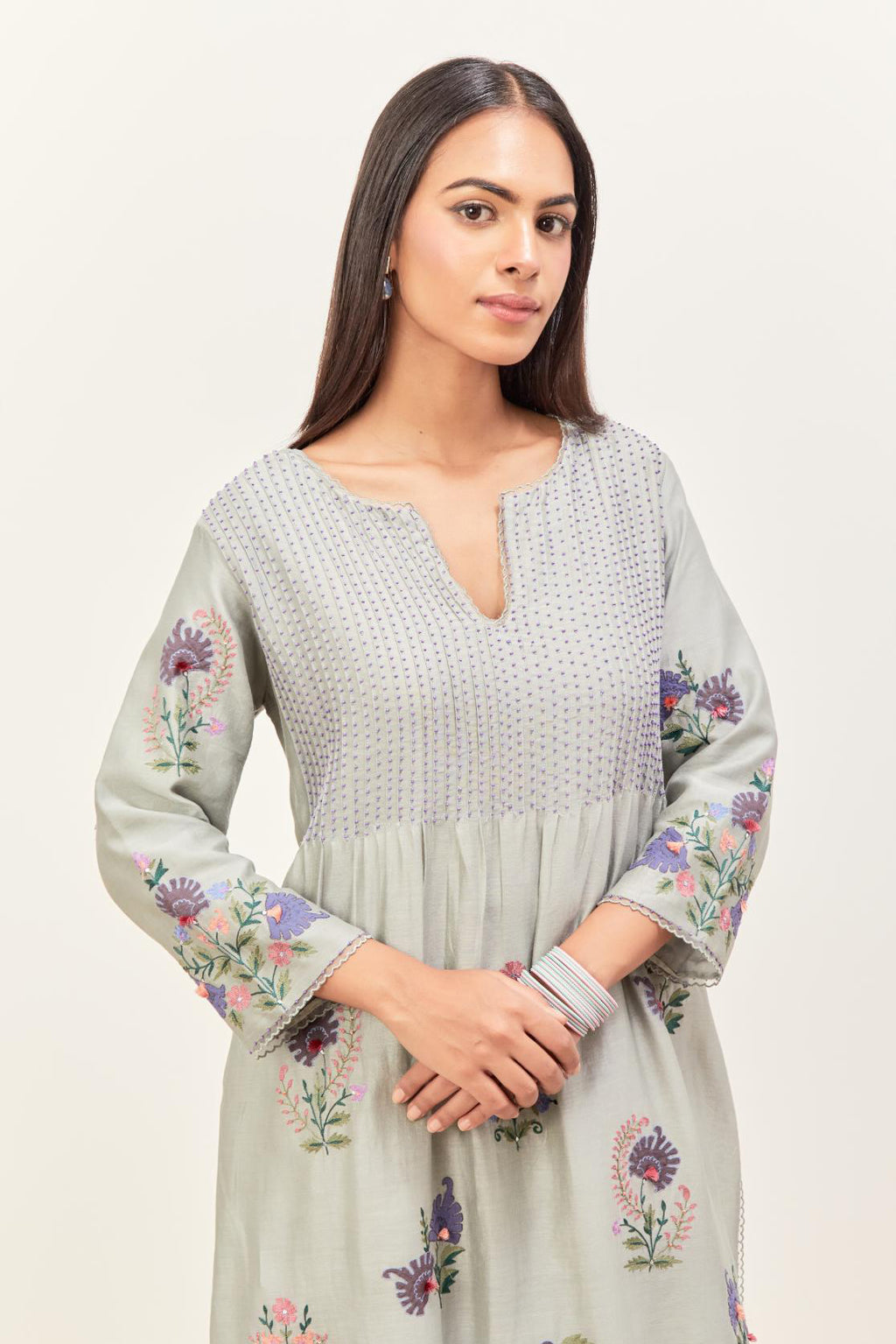 Bluish Grey silk chanderi kurta set with pin tucks at yoke and all-over applique, highlighted with aari threadwork & sequins.