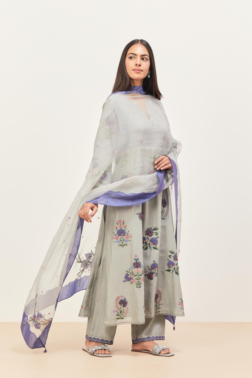 Bluish Grey silk chanderi kurta set with pin tucks at yoke and all-over applique, highlighted with aari threadwork & sequins.