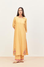 Yellow silk chanderi kurta set with pin tucks in the front & back and floral applique boota at sides, highlighted with aari threadwork & sequins.