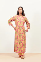 Yellow straight kurta set, fully embroidered with appliqué flowers, multi-colored aari threadwork and silk tassels.