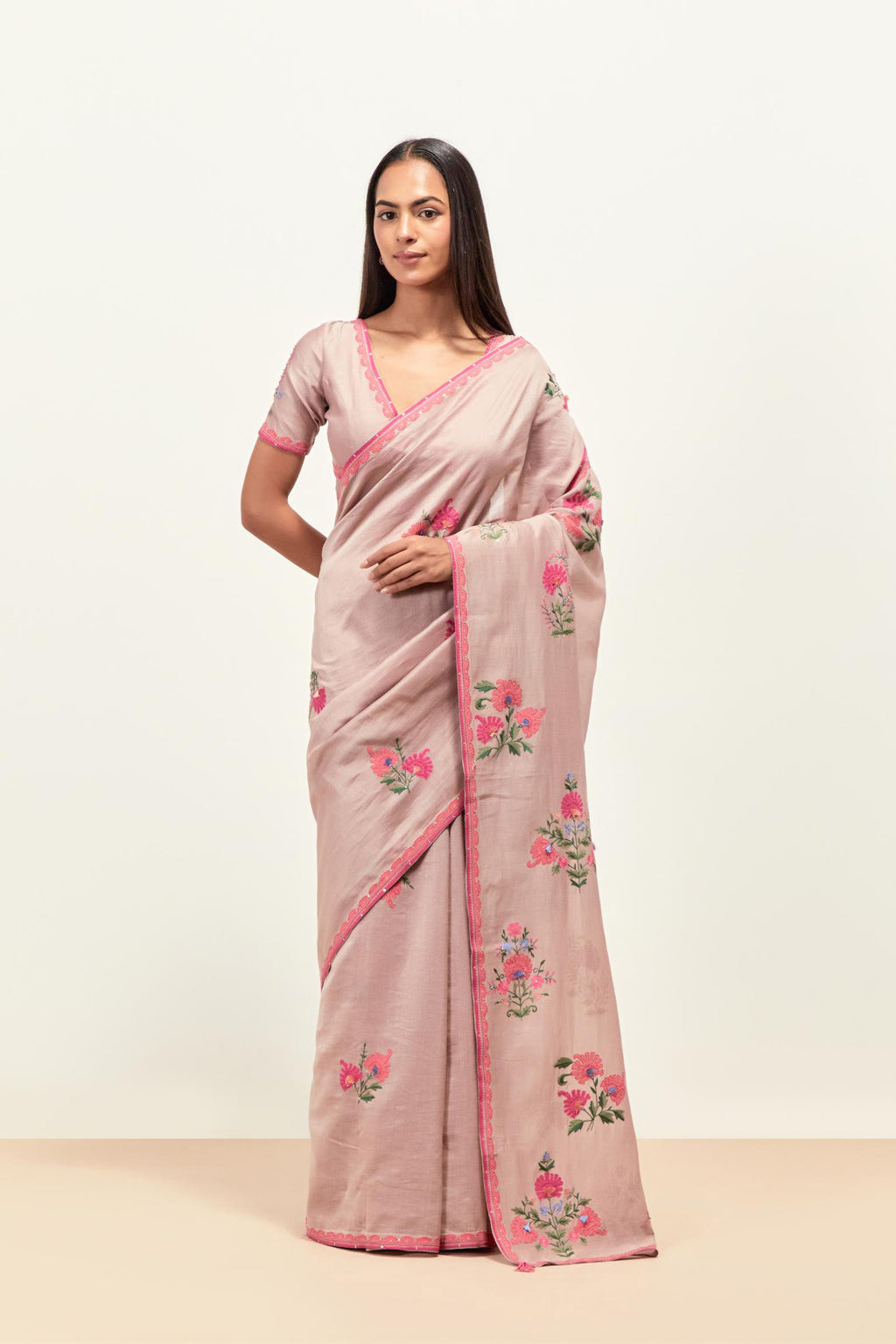 Lilac silk chanderi saree with all-over applique floral boota, highlighted with aari thread work and sequins, paired with lilac silk Chanderi blouse with appliqué work, further enhanced by delicate aari thread embroidery and sequins.