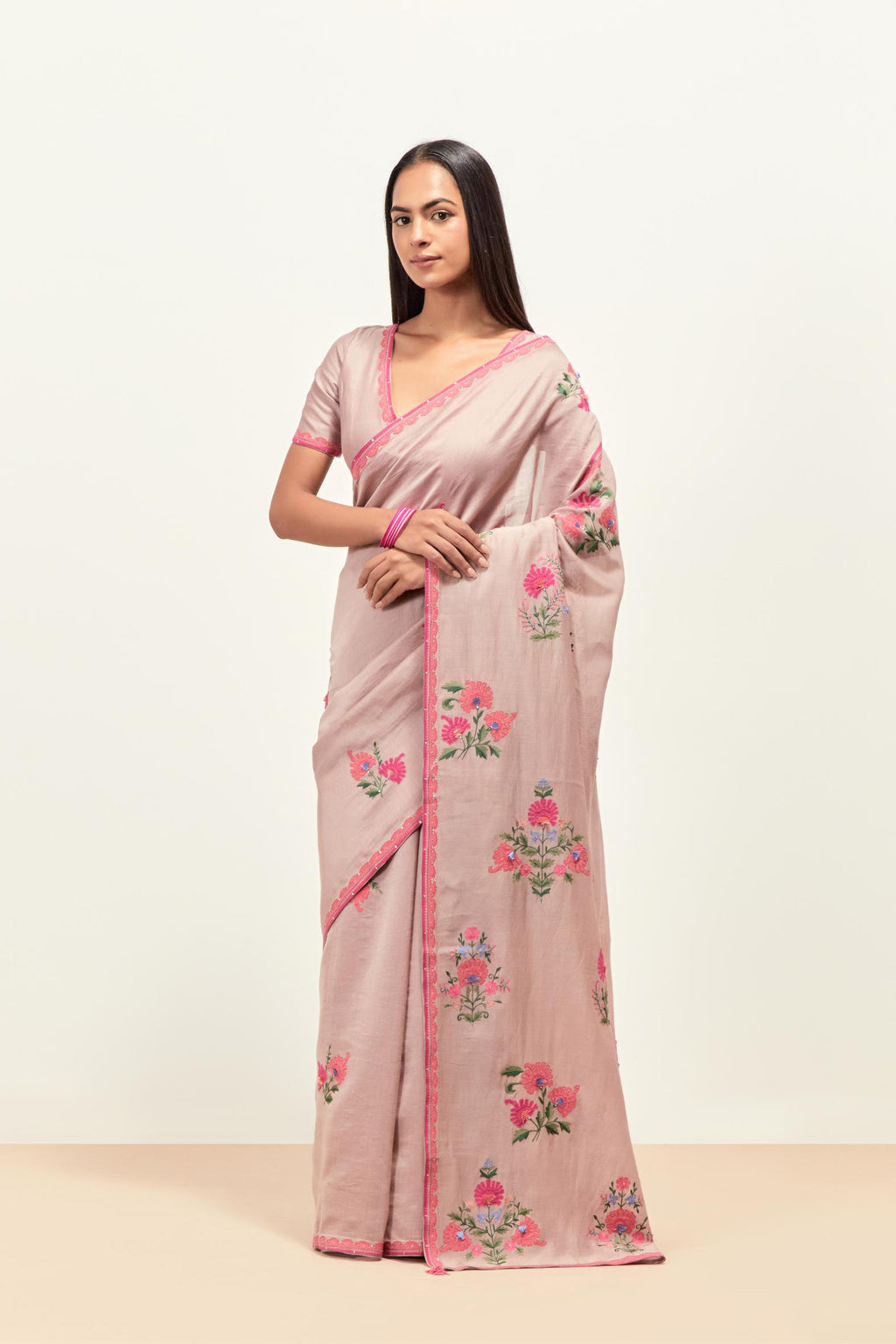 Lilac silk chanderi saree with all-over applique floral boota, highlighted with aari thread work and sequins, paired with lilac silk Chanderi blouse with appliqué work, further enhanced by delicate aari thread embroidery and sequins.