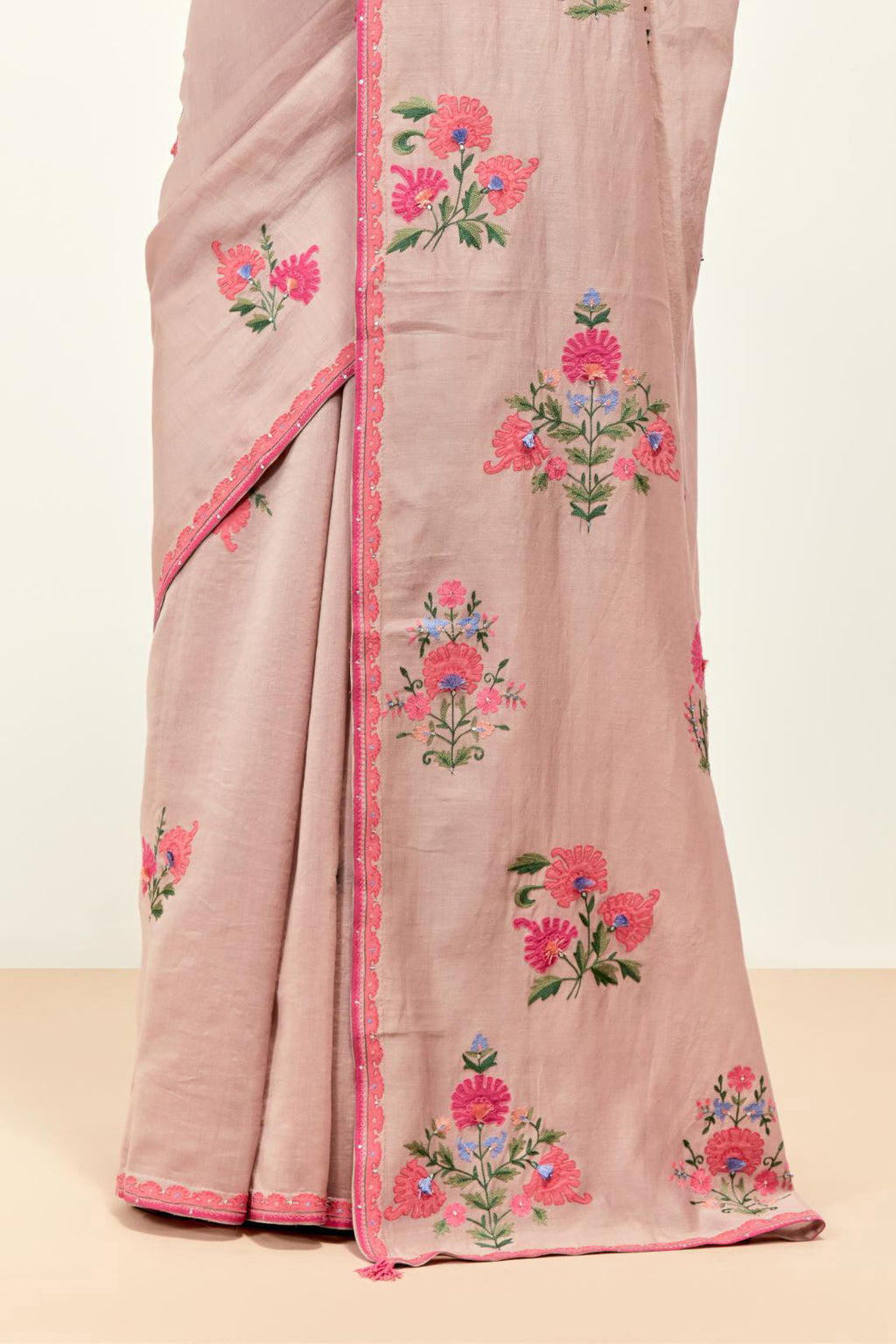 Lilac silk chanderi saree with all-over applique floral boota, highlighted with aari thread work and sequins, paired with lilac silk Chanderi blouse with appliqué work, further enhanced by delicate aari thread embroidery and sequins.