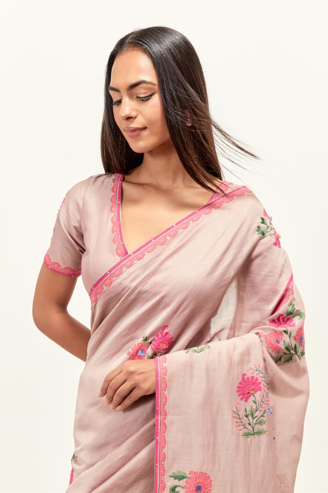 Lilac silk chanderi saree with all-over applique floral boota, highlighted with aari thread work and sequins, paired with lilac silk Chanderi blouse with appliqué work, further enhanced by delicate aari thread embroidery and sequins.