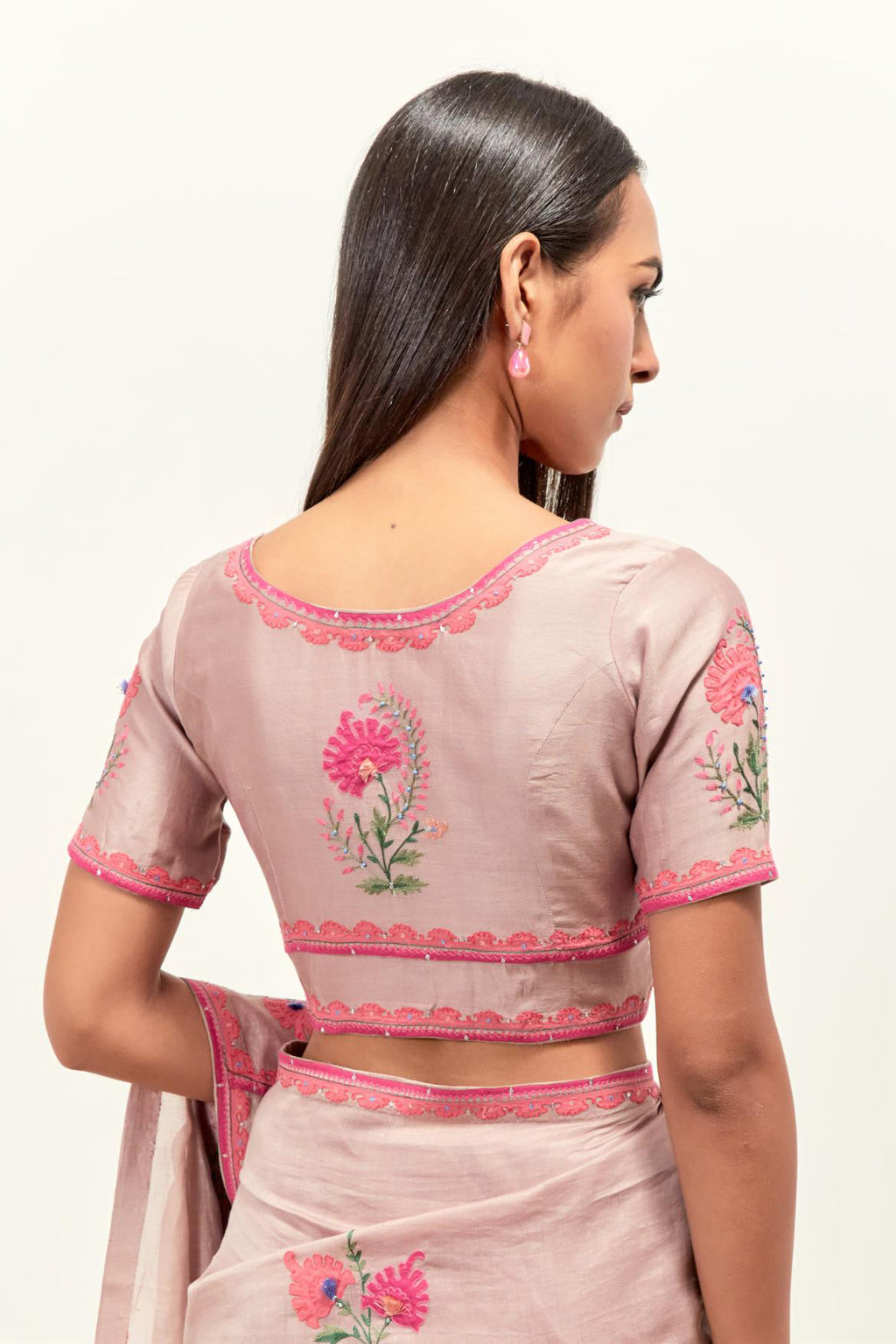 Lilac silk chanderi saree with all-over applique floral boota, highlighted with aari thread work and sequins, paired with lilac silk Chanderi blouse with appliqué work, further enhanced by delicate aari thread embroidery and sequins.