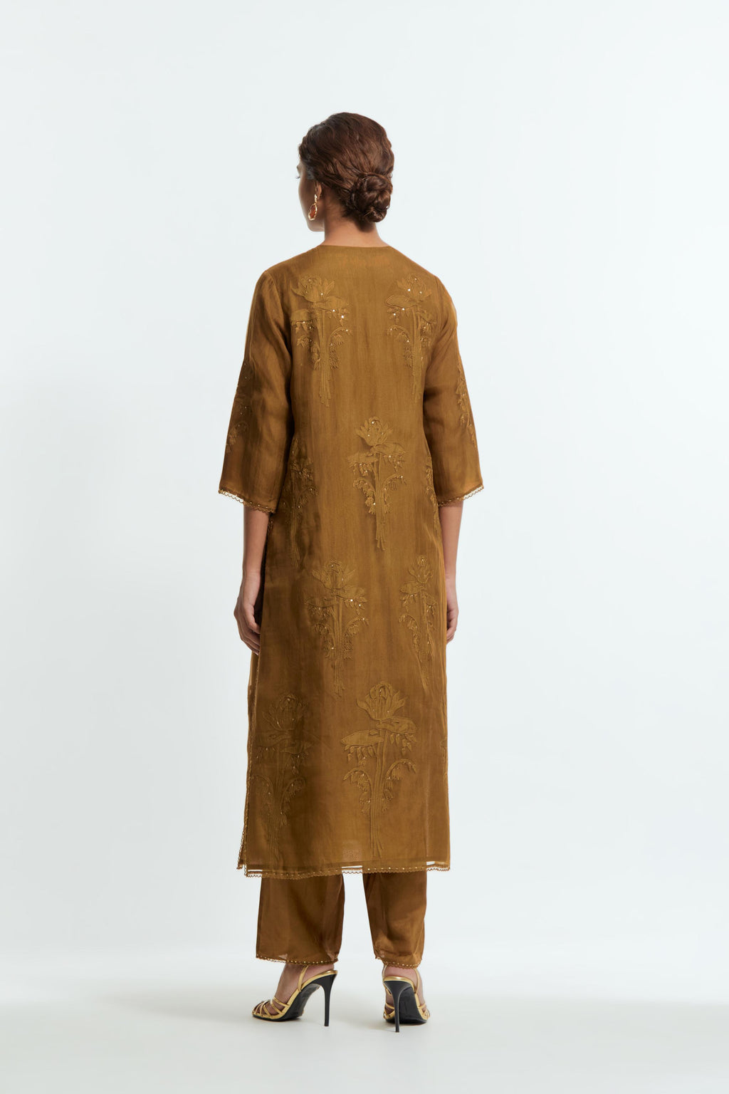 An olive straight silk organza kurta set featuring a round neckline, adorned with delicately placed silk floral boota appliqués and sequin work.