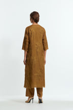 An olive straight silk organza kurta set featuring a round neckline, adorned with delicately placed silk floral boota appliqués and sequin work.