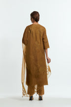 An olive straight silk organza kurta set featuring a round neckline, adorned with delicately placed silk floral boota appliqués and sequin work.