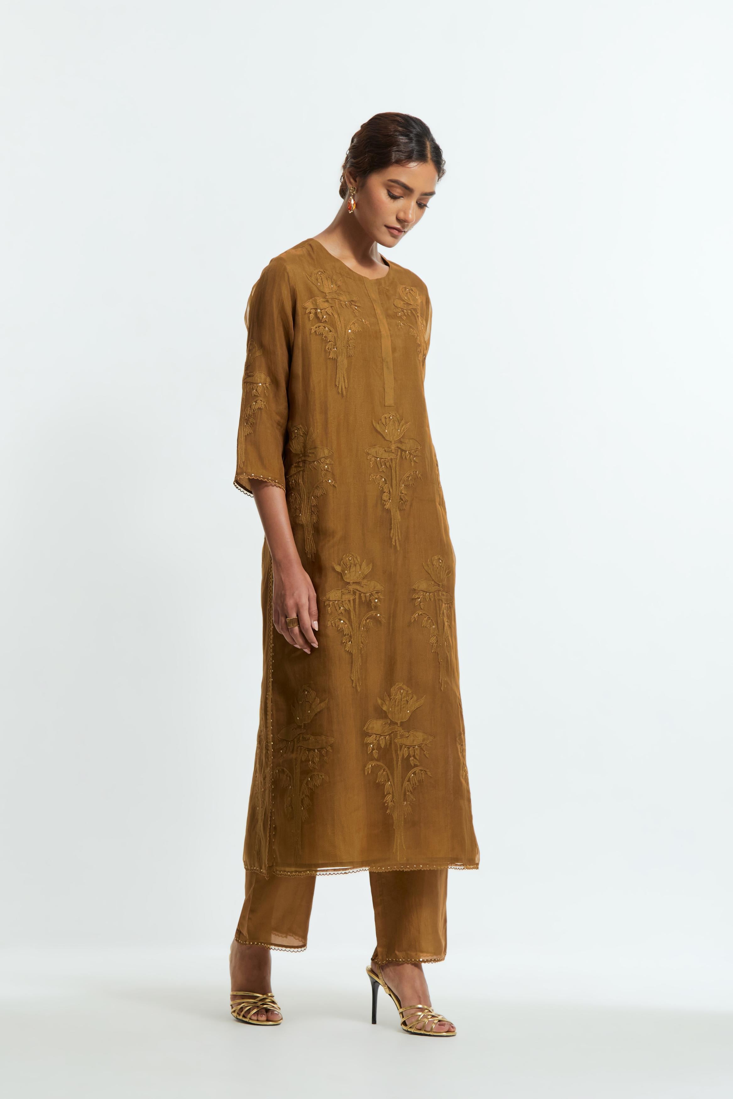 An olive straight silk organza kurta set featuring a round neckline, adorned with delicately placed silk floral boota appliqués and sequin work.