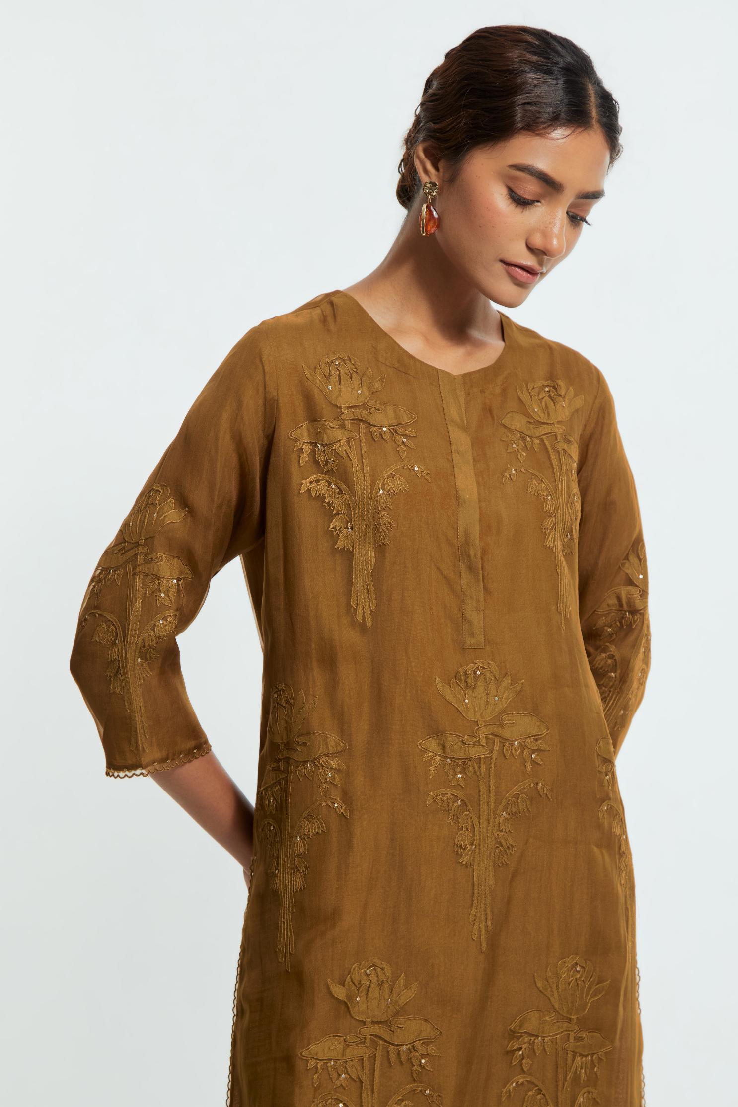 An olive straight silk organza kurta set featuring a round neckline, adorned with delicately placed silk floral boota appliqués and sequin work.