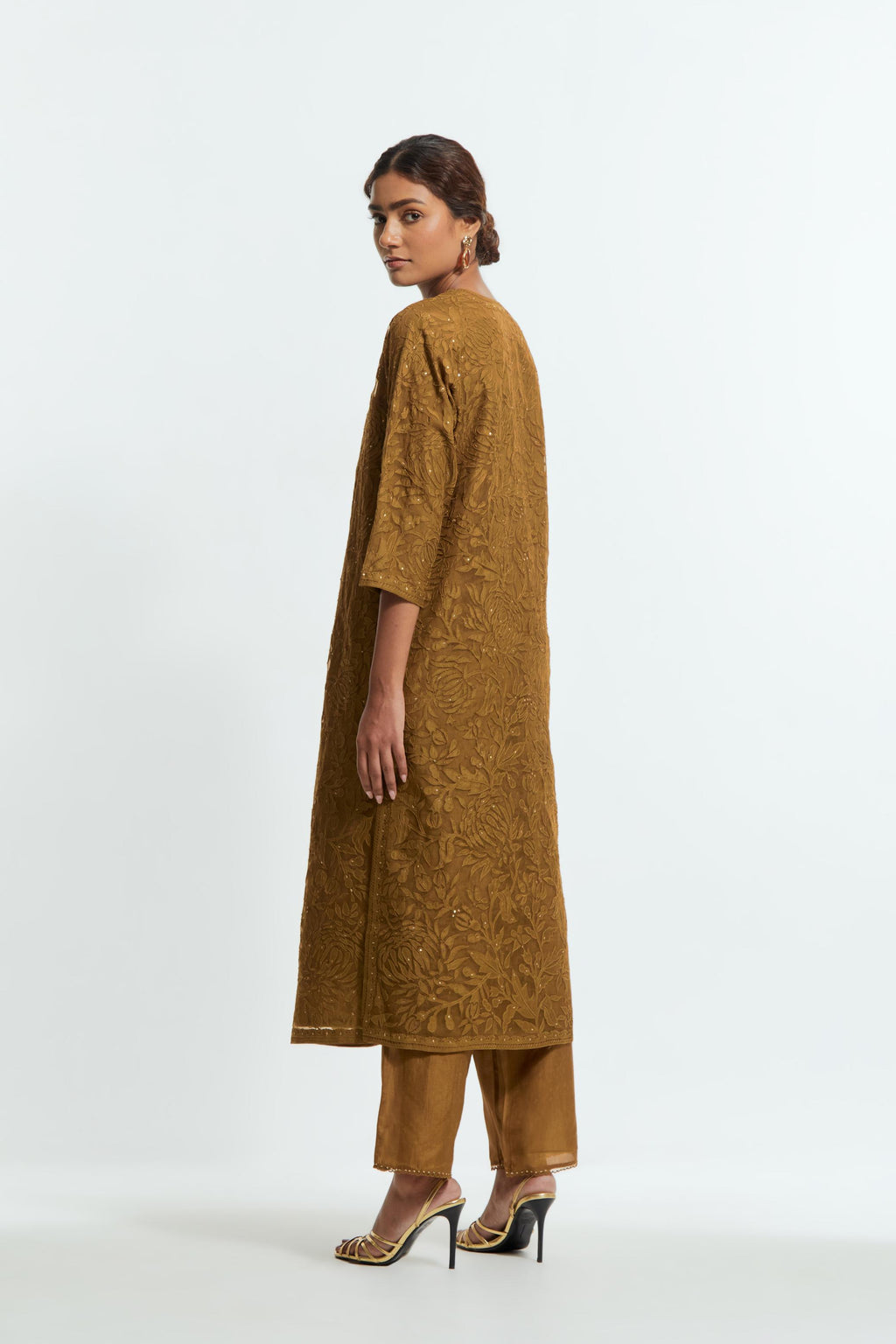 Olive silk organza straight kurta set featuring an all-over silk appliqué trellis jaal, delicately highlighted with subtle sequins.