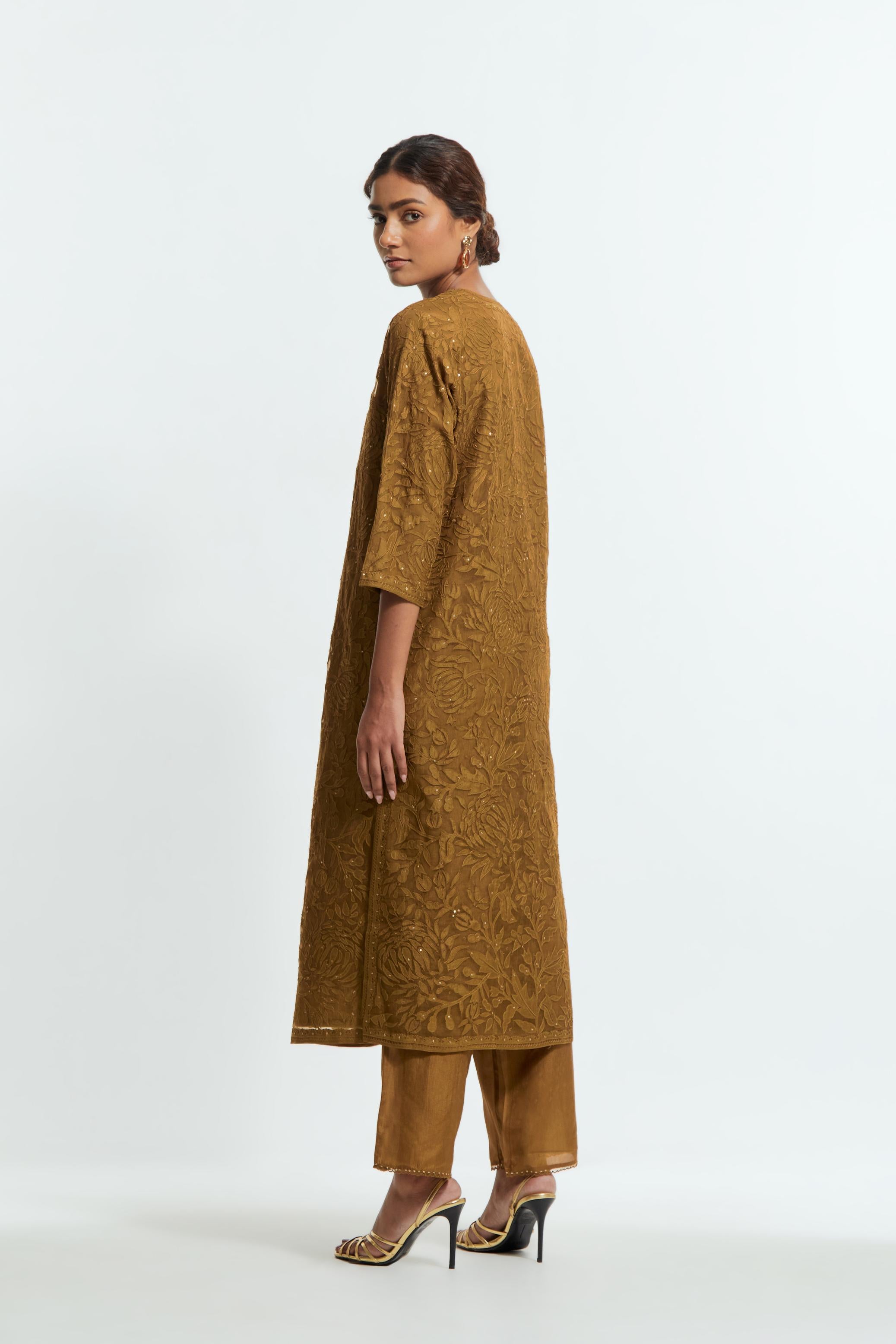 Olive silk organza straight kurta set featuring an all-over silk appliqué trellis jaal, delicately highlighted with subtle sequins.
