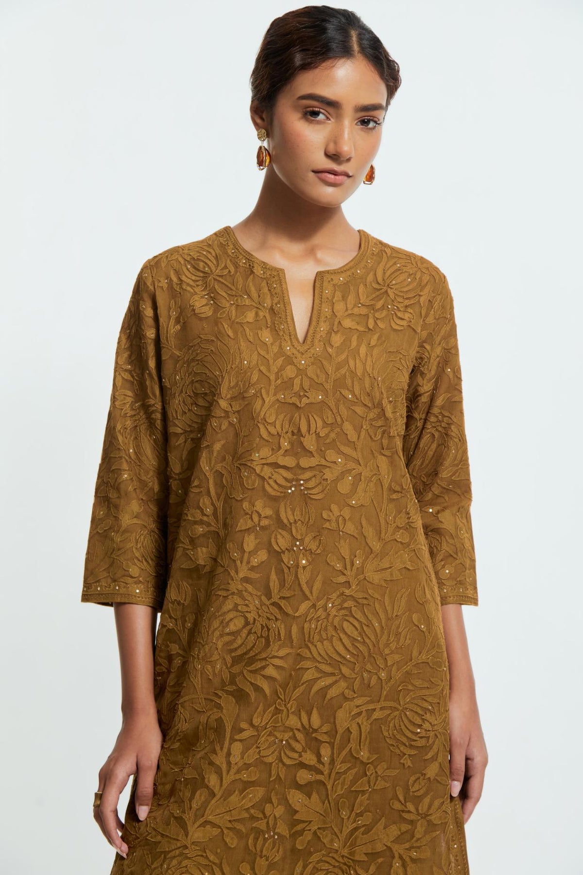 Olive silk organza straight kurta set featuring an all-over silk appliqué trellis jaal, delicately highlighted with subtle sequins.
