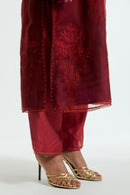 A Red straight silk organza kurta set featuring a round neckline, adorned with delicately placed silk floral boota appliqués and sequin work.