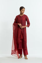 Red silk organza dupatta featuring silk appliqué embroidery, delicately highlighted with subtle sequins.