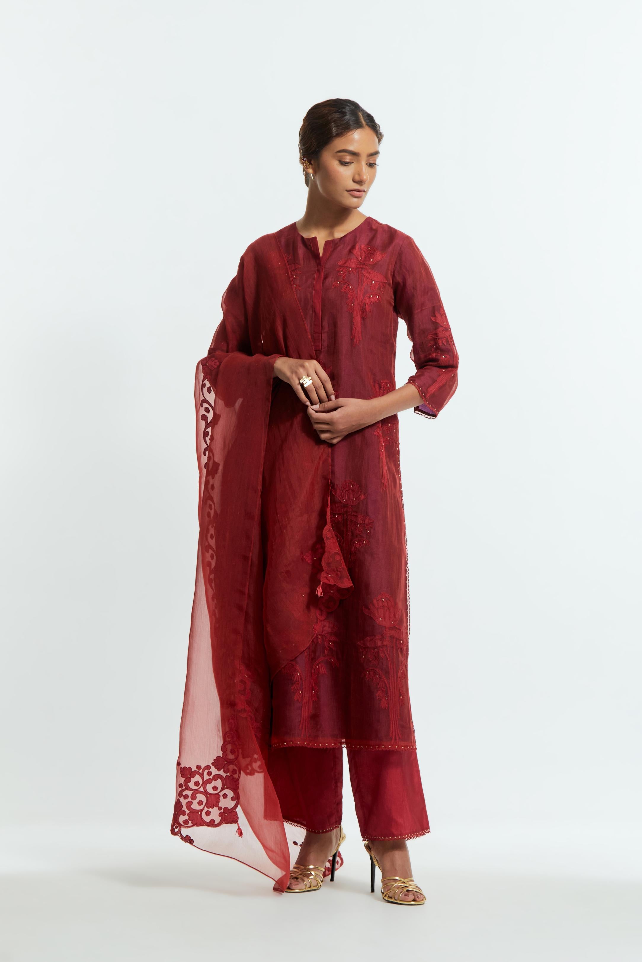 Red silk organza dupatta featuring silk appliqué embroidery, delicately highlighted with subtle sequins.