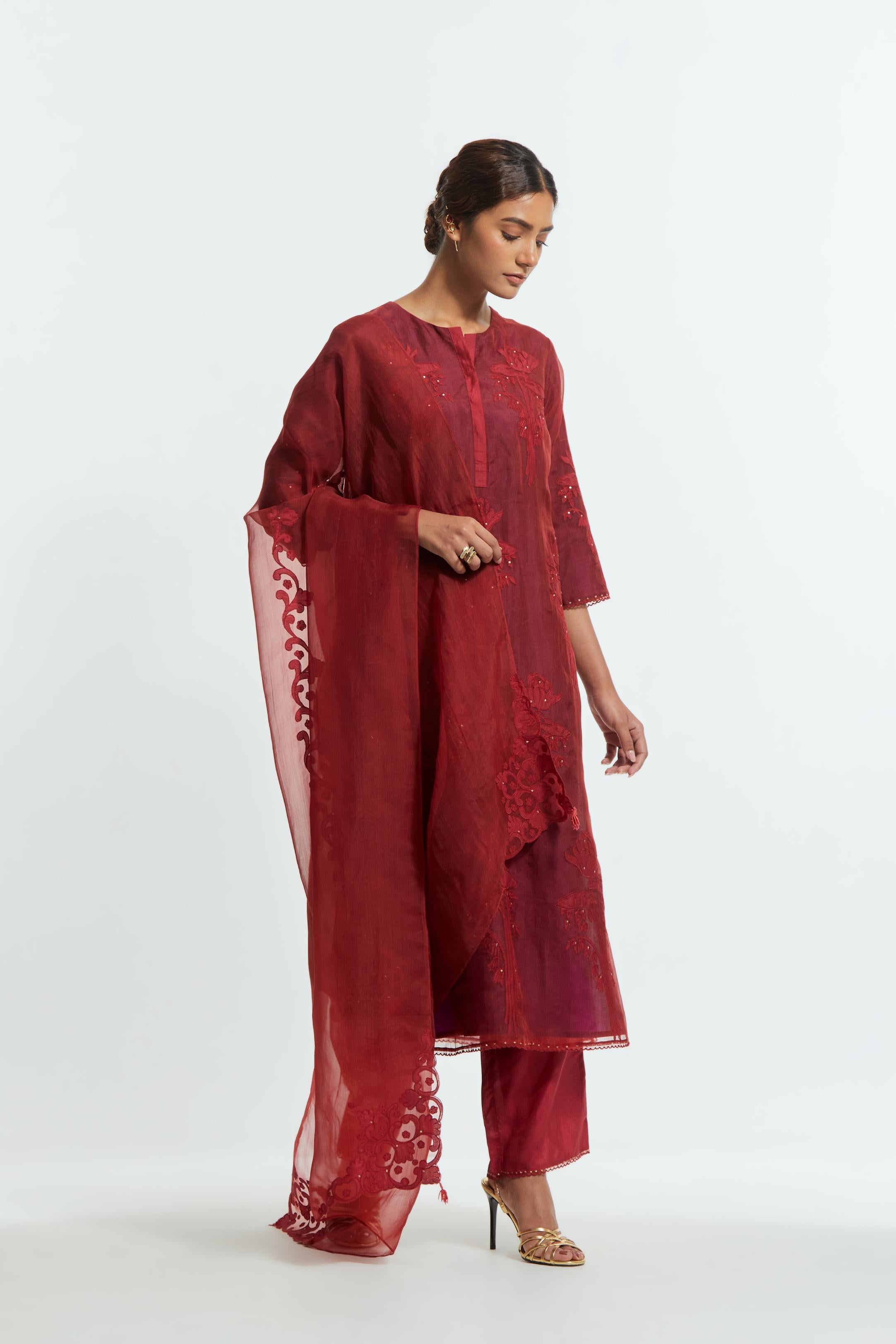 Red silk organza dupatta featuring silk appliqué embroidery, delicately highlighted with subtle sequins.