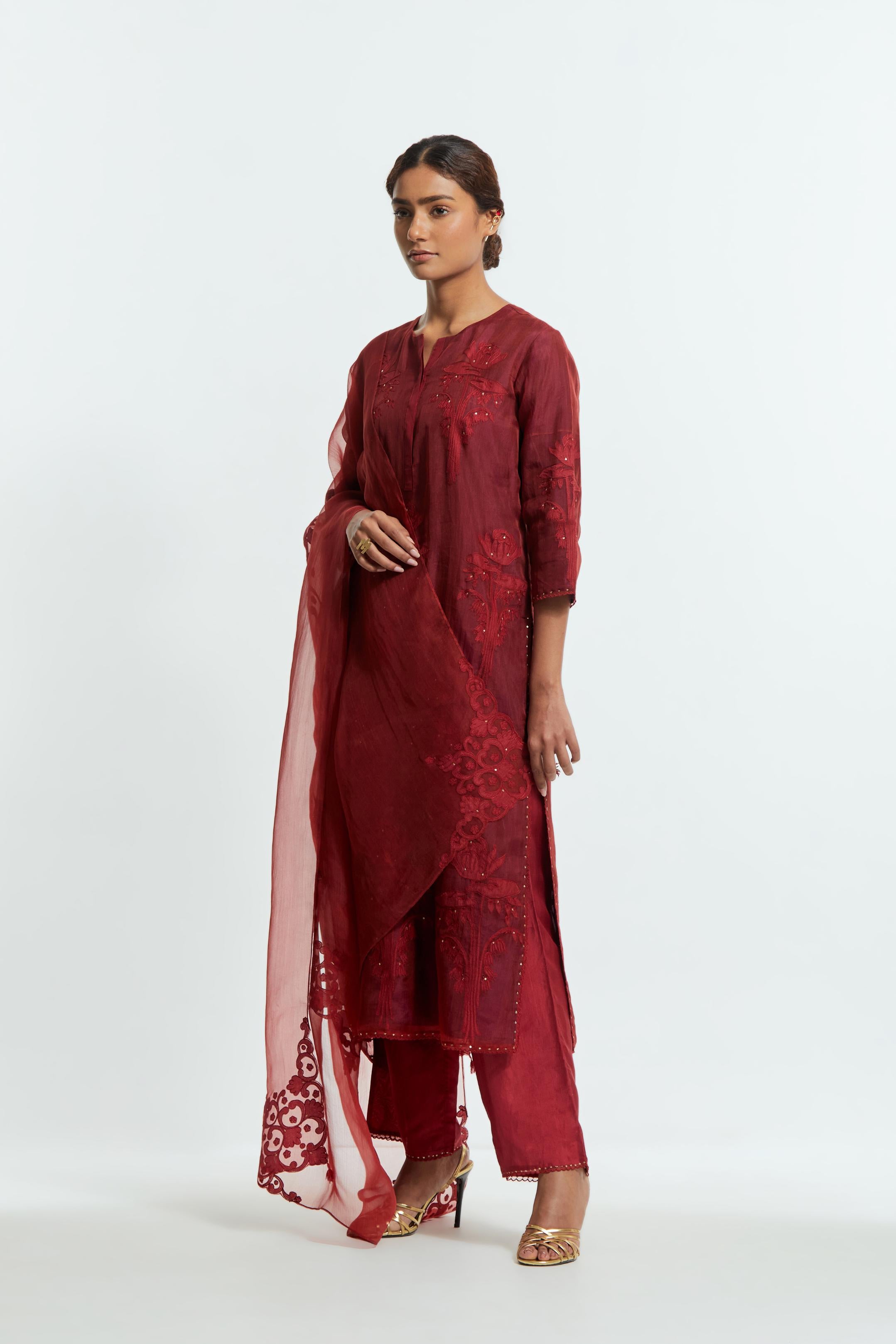 Red silk organza dupatta featuring silk appliqué embroidery, delicately highlighted with subtle sequins.