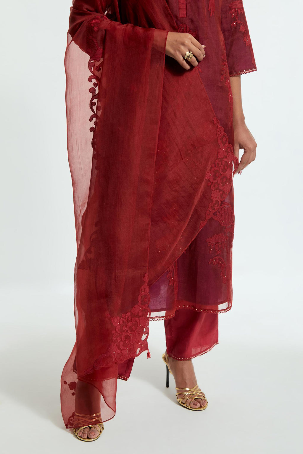 Red silk organza dupatta featuring silk appliqué embroidery, delicately highlighted with subtle sequins.